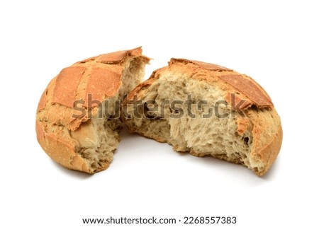A sourdough bread broken in half, isolated on white background