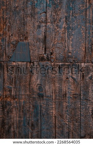 Background of wooden boards with a blue paint worn by time.