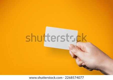 Hand with classic blank bank card