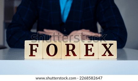The word FOREX written on wood cube.