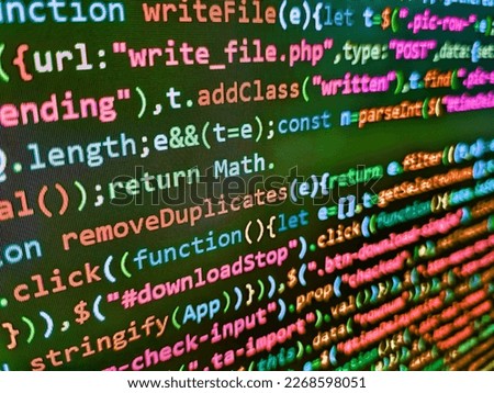 Concept of security, programming and hacking, deep decryption and encryption. Closeup of Java Script and HTML code. Screen of web developing php code on dark background