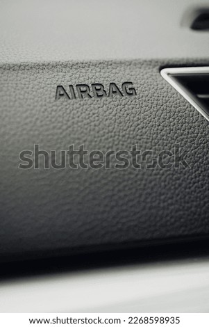 Close up shot of a car's passenger airbag. Royalty-Free Stock Photo #2268598935