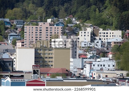The springtime view of different buildings surrounded by wilderness in Juneau downtown, the capital of Alaska.