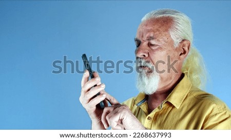 The White Haired Old Man Talks on the Cellphone Photo