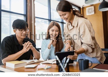 Asian student girl High School Tutor Individual Tuition From Teacher In Library. University Student Tutor books with friends Royalty-Free Stock Photo #2268653325