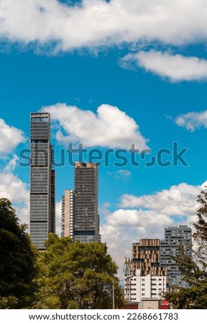 This breathtaking photo captures the iconic buildings of Bogotá's city center in all their splendor, set against a backdrop of clear blue skies. 