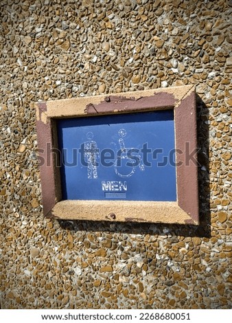 Blue Men's Bathroom Sign Outside