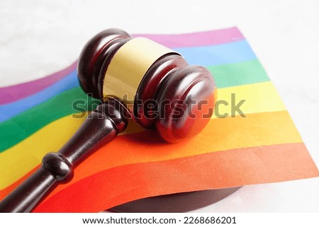 Gavel for judge lawyer with heart rainbow flag, symbol of LGBT pride month. Royalty-Free Stock Photo #2268686201