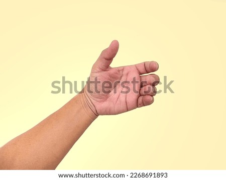 Close up of empty hand showing in various gestures, holding things, hand holding, telephone paper, card, coin, water bottle, small and large size, isolated on primrose background and practical concept