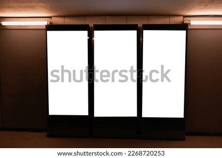 Three blank billboard advertising space on wall for mock up digital advertising placement template 