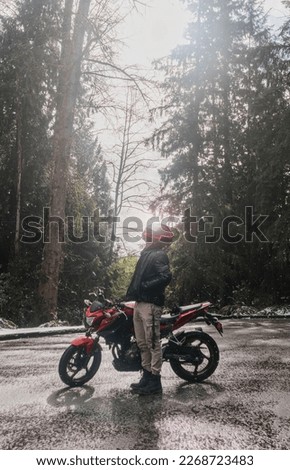 Photography of biker on  a motorcycle under the sunrise.  Royalty-Free Stock Photo #2268723483