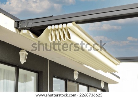Folded pergola with detail of fabric Royalty-Free Stock Photo #2268736625
