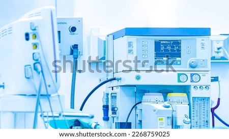 Inhalation anesthetic machine in modern operating room.General anesthesia was done in hospital.Surgery was perform after anesthesiologist worked with patient.Medical instrument in operating theater. Royalty-Free Stock Photo #2268759025