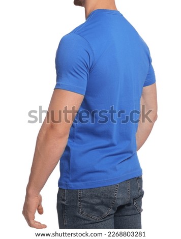 Man wearing blue t-shirt on white background, closeup. Mockup for design