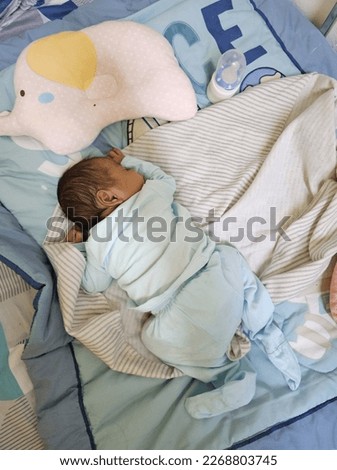 KUALA LUMPUR, MALAYSIA - 1st March 2023: Pictures of a sleeping baby boy.
