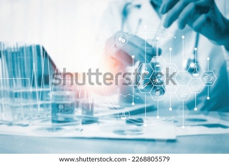 Doctors working in a hospital's pathology lab are analyzing scientific data on the current COVID-19 pandemic. Royalty-Free Stock Photo #2268805579
