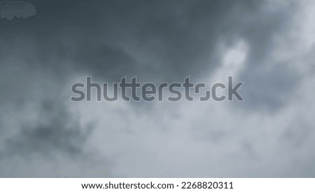 Blue sky on a sunny day with gray white clouds. Nature background.