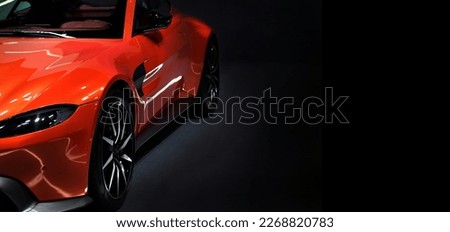 Front headlights of orange supercar on black background,copy space Royalty-Free Stock Photo #2268820783