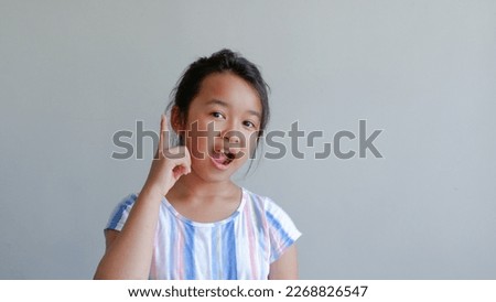 Close-up portrait of her beautiful attractive beautiful sweet curious playful cheerful smart clever girl creating new idea solution fantasizing copy space isolated gray background.