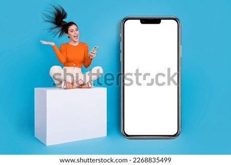 Photo of cute good mood emotion lady with flying hairstyle see goo offer promotion isolated on blue color background
