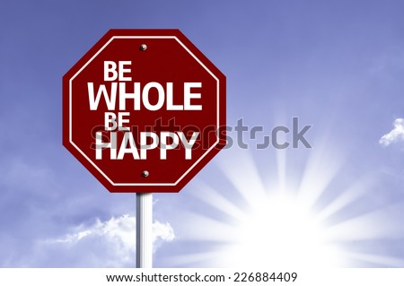 Be Whole Be Happy written on red road sign with a sky on background