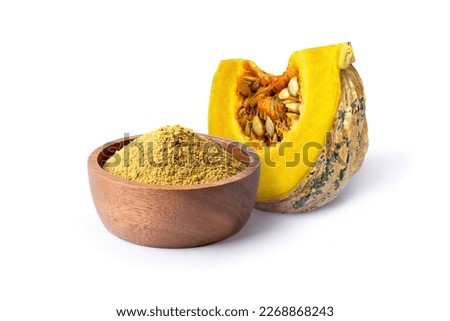 Pumpkin powder in wooden bowl and fresh pumpkin sliced isolated on white background.
