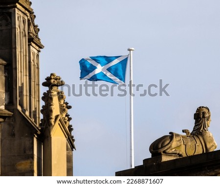 The Scottish flag, flying proudly in the old town area of Edinburgh, Scotland, UK. Royalty-Free Stock Photo #2268871607