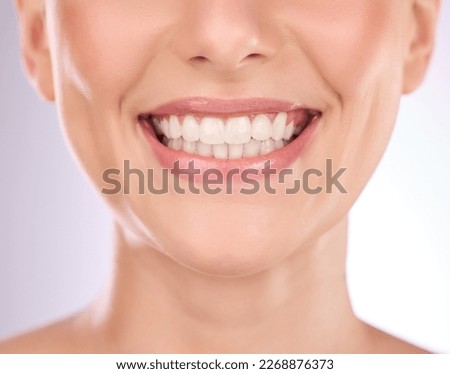 Teeth, dental and oral hygiene with a model woman in studio on a gray background for tooth whitening. Dentist, healthcare and veneers with a female indoor to show a happy smile at a mouth specialist Royalty-Free Stock Photo #2268876373