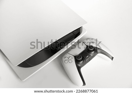 Next Generation game console and controller in close view Royalty-Free Stock Photo #2268877061