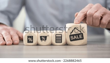 Wooden blocks with symbol of sales and discounts concept