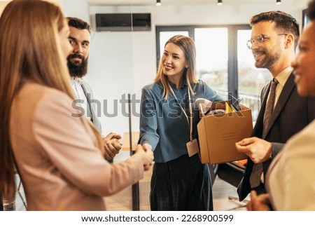 Young woman having first working day getting acquainted with colleagues Royalty-Free Stock Photo #2268900599