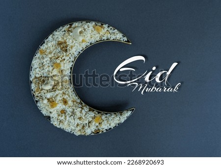 Eid Mubarak Greetings Biryani in a crescent moon shape plate flatly image Royalty-Free Stock Photo #2268920693