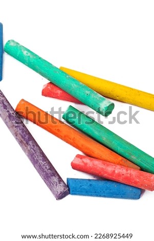 Colored crayons isolated on white background close up