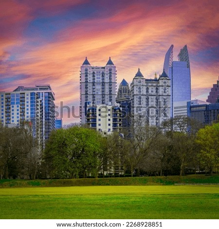 Atlanta City skyline with skyscrapers, buildings, and dramatic sunset clouds over Piedmont Park in the Capital of the U.S. State of Georgia