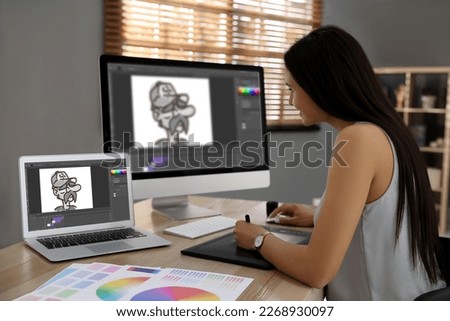 Animator working with graphic tablet, computer and laptop. Illustrations on screens
