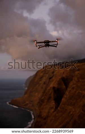 A drone flying over landscapes and making beautiful pictures and videos