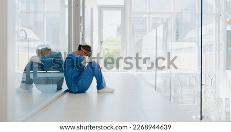 Doctor, stress and woman with depression, burnout and overworked in hospital, deadline and tired. Healthcare, medical professional and nurse crying for mistake, depressed and fatigue with anxiety Royalty-Free Stock Photo #2268944639