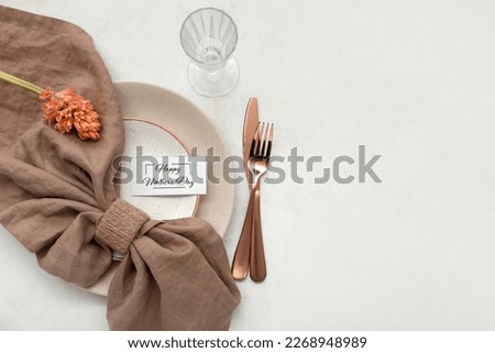 Stylish table setting with hyacinth flower for Mother's Day celebration on light background