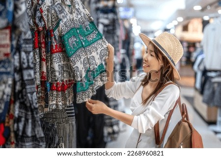 Asian woman travel and shoping in and walking in Platinum market in Bangkok city, Thailand Royalty-Free Stock Photo #2268960821