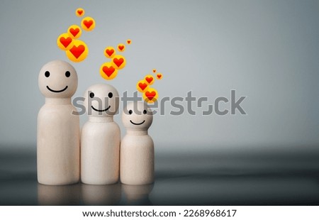 Happy wooden figures peg doll of family members, Family relationships, foster care, family mental health, international day of families. Family relationship concept