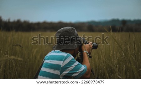 a photographer is taking a landscape 