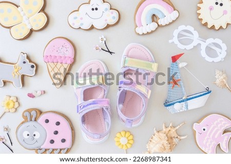 Bright summer background. Cute summer symbols on gray background. Top view, Flat lay. Creative summer concept.