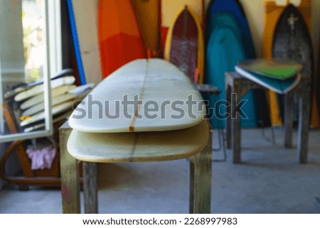 Workshop repair and restoration of surfboards.