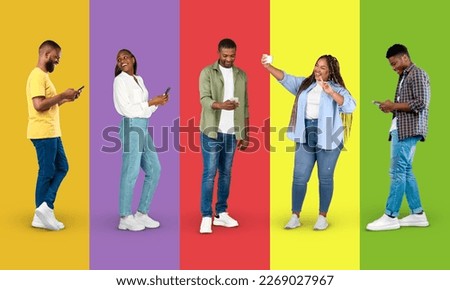 App for blog and social networks. Happy adult black people in casual chatting on smartphone, taking selfie on colorful background, studio, panorama, full length. Modern gadget, surfing, ad and offer