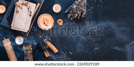 Tarot, astrology,Esoteric, Occult mystical ritual scene of sorcery tarot candles,dried flowers, palo santo tarot cards, ritual book.Witchcraft,mysticism and occultism,esoteric background,tarot banner Royalty-Free Stock Photo #2269029189