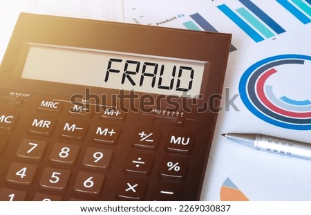 Word fraud on calculator. Business and finance concept.