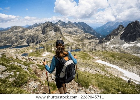 Young girl summit to Ratera Peak in Aiguestortes and Sant Maurici National Park, Pyrenees, Spain