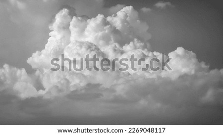 Powerful black and white storm cloud. Cumulonimbus of great stormy development. Black and white sky with storm clouds. 