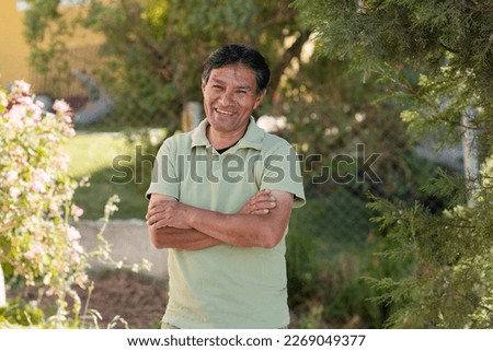 Smiling Latino man outside his house in rural area - Happy Mayan senior - Hispanic proud of his roots Royalty-Free Stock Photo #2269049377