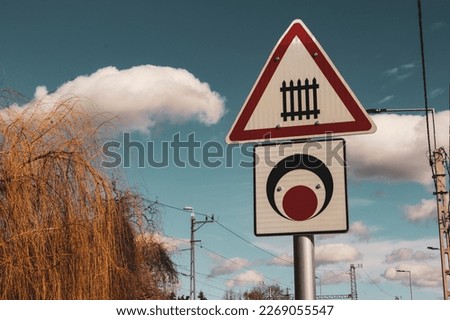Road sign in the background with the blue sky